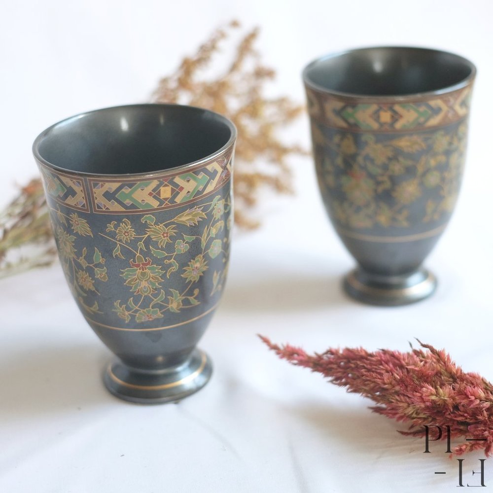 Two adorn black porcelain glasses - signed